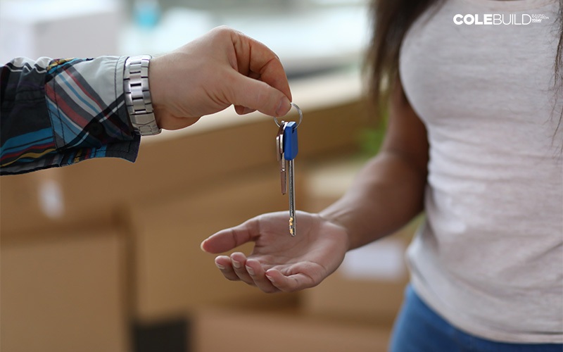 woman receiving house keys